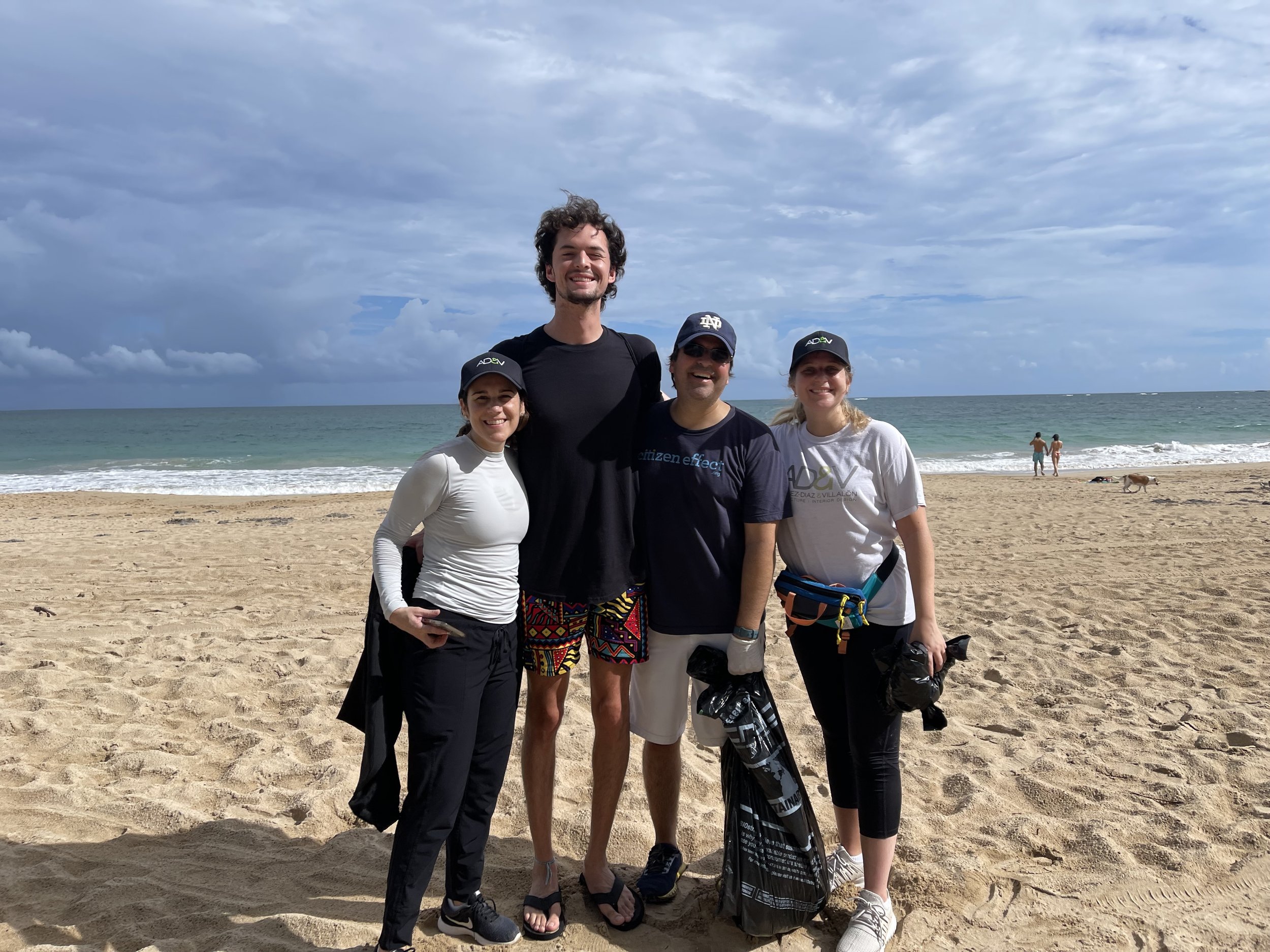  AD&amp;V team members picking up trash at a local beach. 