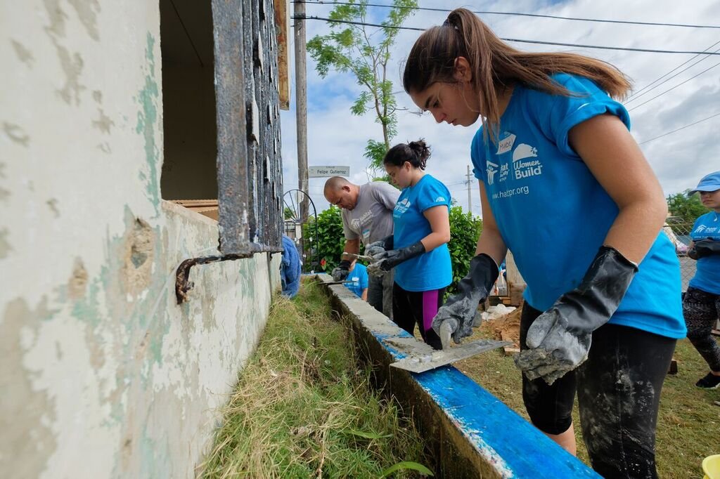  Volunteers working on reconstruction of homes 