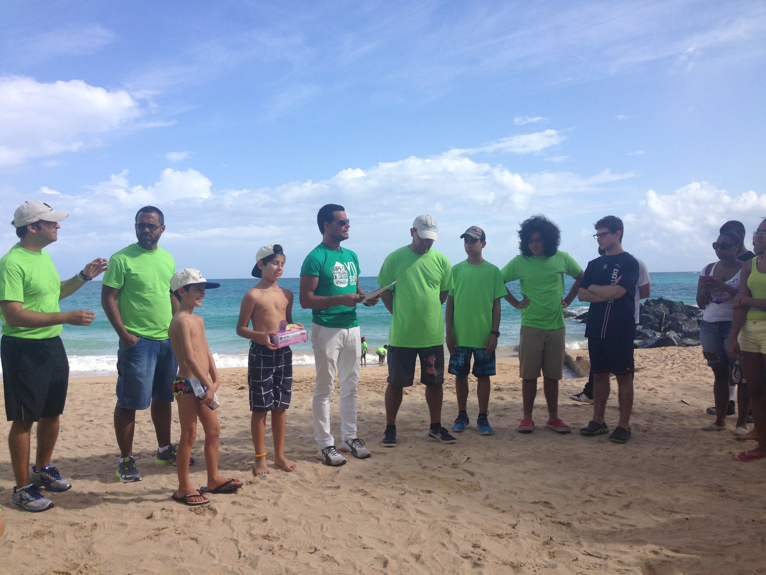  Volunteers gathering at beach cleanup 