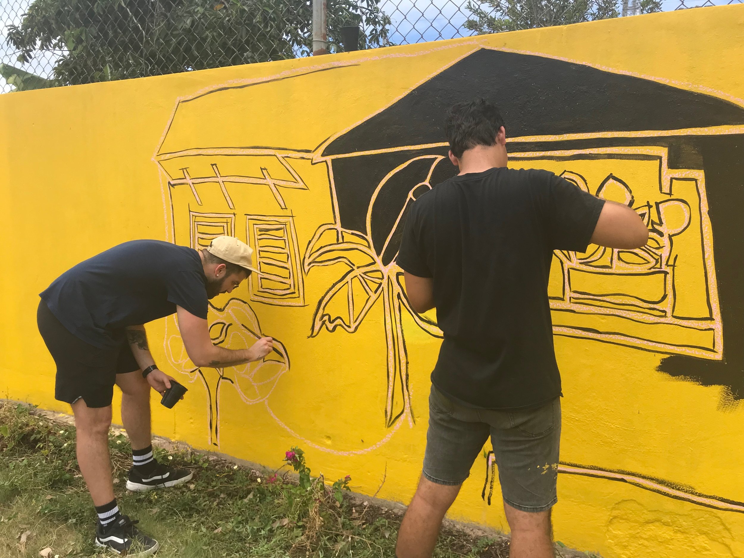  AD&amp;V team members painting mural 