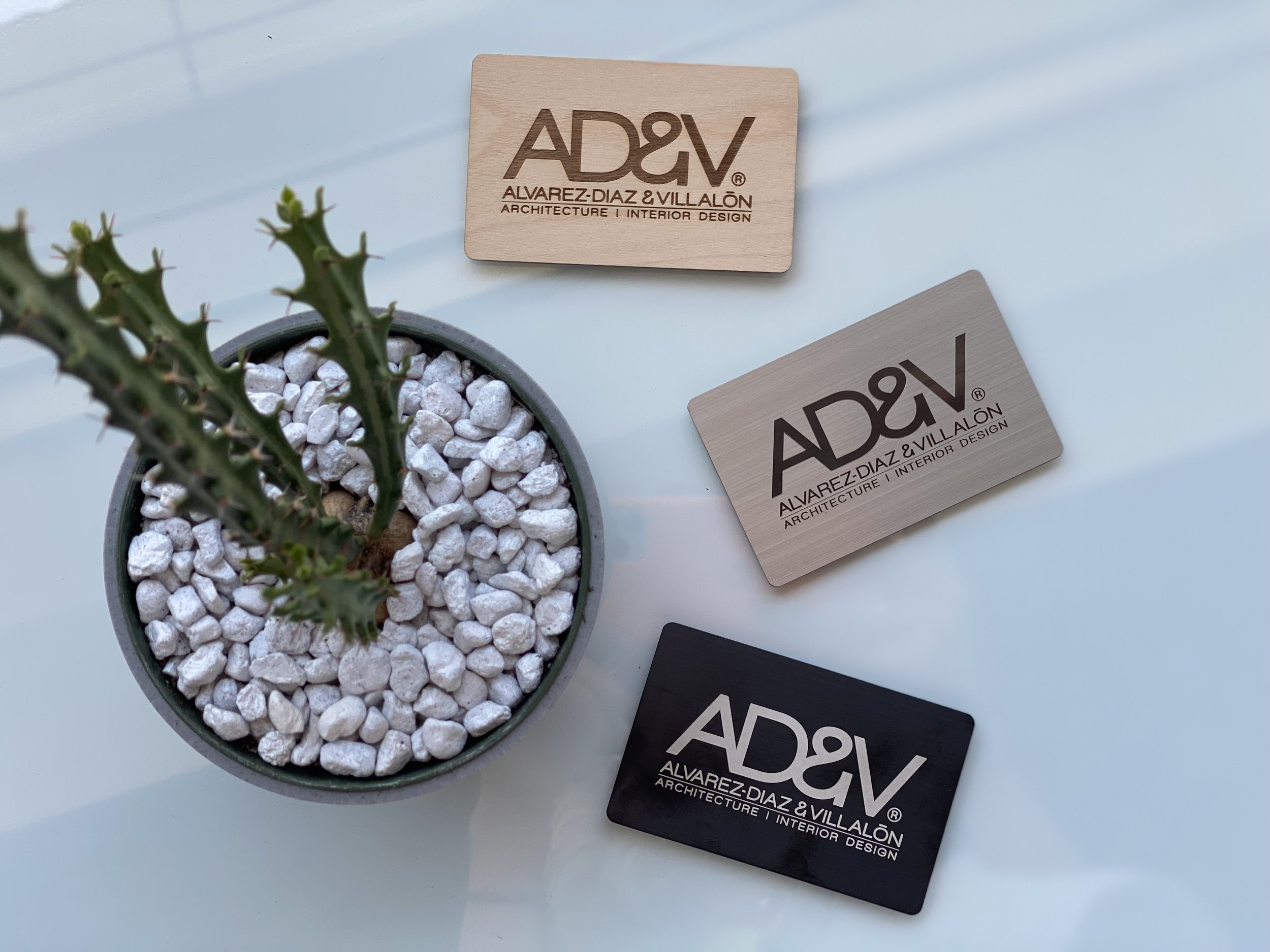  AD&amp;V business cards on table 