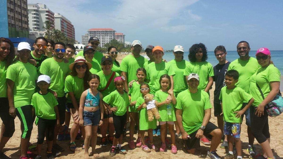  AD&amp;V team posing for picture at beach cleanup 