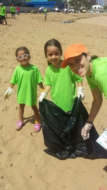  AD&amp;V family cleaning up debris at beach 